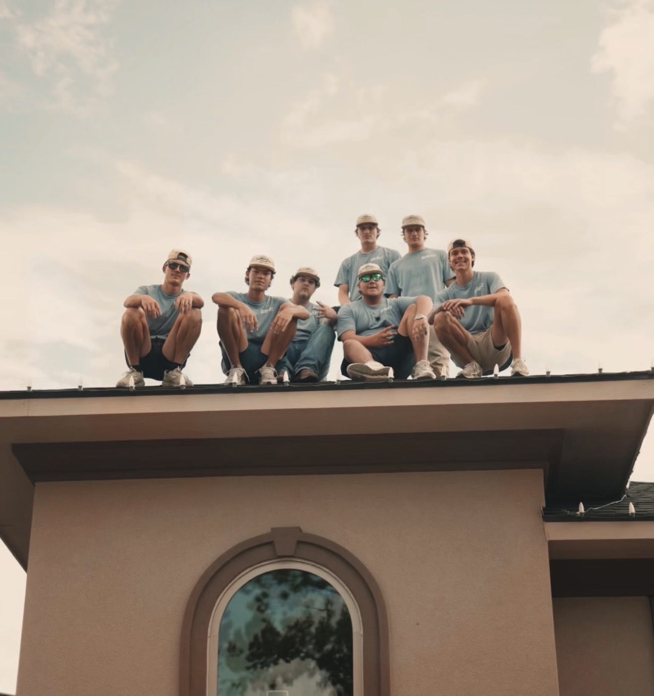 Southern Boys Christmas Lights crew together on a roof