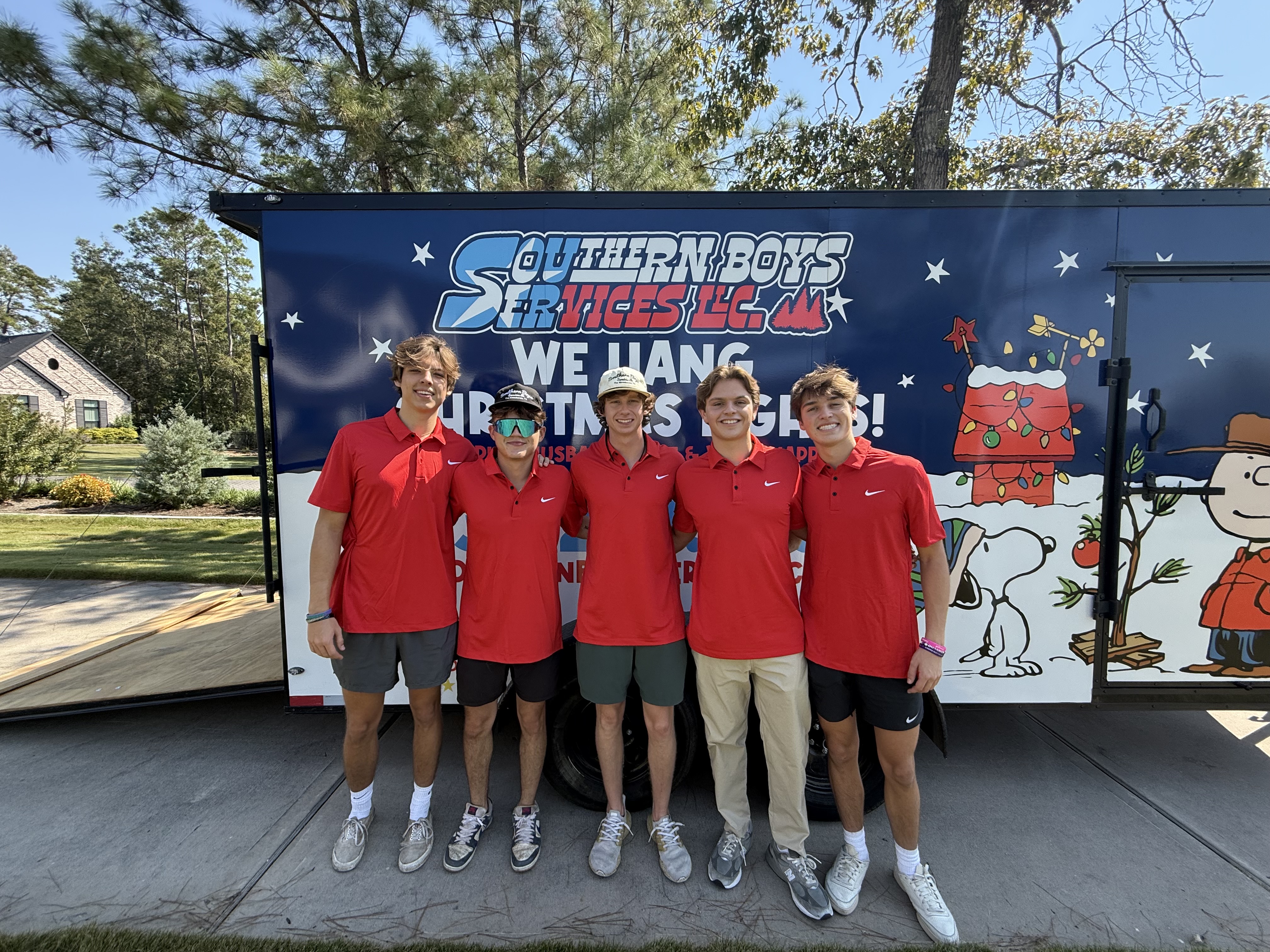 Five Southern Boys team members in front of their trailer